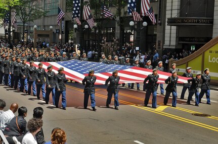 Junior Reserve Officers Training Corps cadets march down State Street in Chicago carrying the American flag during the City of Chicago’s Memorial Day parade on May 23. Forty-five JROTC schools and academies were represented there with more than 6,000 cadets marching in
the parade. (U.S. Army photo by Sgt. Aaron Berogan)