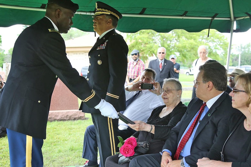 Army Reserve Col. Albert F. Gruber, left, 330th Medical Brigade, presents the Silver Star to Betty Jane DePriest, 86, during a military funeral honor ceremony recognizing Army Sgt. Lawrence V. Blanchet, WWII Veteran, killed in action on the Italian front with the 92nd Infantry “Buffalo” Division in 1945. During the ceremony the Blanchet family also received a U.S. flag. The ceremony also included three volleys of shots fired, taps played and a flag folding presentation.

(U.S. Army photo by Anthony L. Taylor/Released)