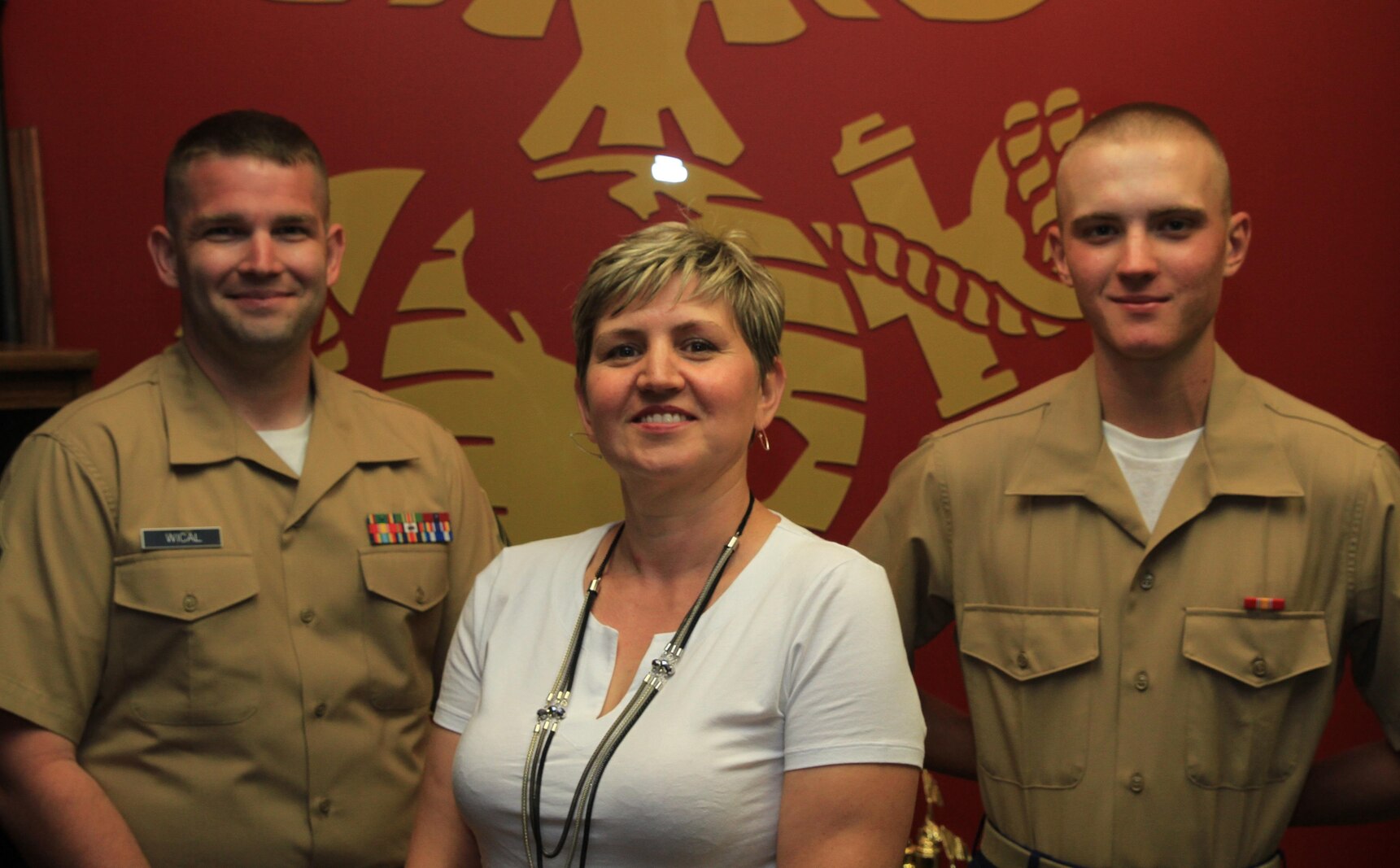 Ewa Perkowski, (middle) her son, Pvt. Dawid Perkowski (right), and Sgt. Justin Wical, take a moment to post for a photo at Marine Corps Recruiting Substation Reading, recently. Perkowski is a second-generation immigrant from Poland, where his parents knew a different meaning to military service. After some convincing from her son, and an in depth education about the Marine Corps’ rich history and traditions from Sgt. Wical, Ewa her family could not be more proud of their new Marine.