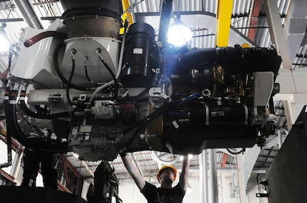 A mechanic for the 88th Regional Support Command guides the power pack belonging to a Nuclear, Biological, Chemical, Reconnaissance Vehicle (NBCRV) Stryker into place, during Field Level Maintenance New Equipment Training (FLMNET) instruction, May 8, at Joint Base Lewis-McChord, Wash. The training is being taken by both 88th RSC civilian mechanics and Soldiers of the 349th and 355th Chemical Companies, both of whom will be fielding the NBCRVs.  The training is taking place April 24-May 12, at Equipment Concentration Site 10, JBLM, and is being hosted by the 88th Regional Support Command. It is the first time FLMNET has been taught in the Army Reserve.