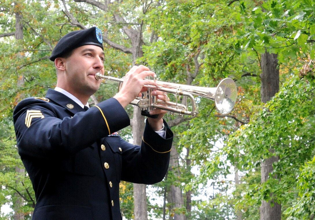 Army Reserve Staff Sgt. Jeff Hotz, 338th Army Band, performs Taps in remembrance of Rutherford B. Hayes during a presidential wreath laying ceremony at his tomb in Fremont, Ohio, Oct. 5, 2014.