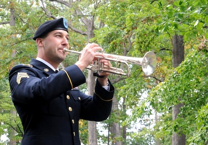 Army Reserve Staff Sgt. Jeff Hotz, 338th Army Band, performs Taps in remembrance of Rutherford B. Hayes during a presidential wreath laying ceremony at his tomb in Fremont, Ohio, Oct. 5, 2014.