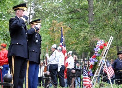 Army Reserve Brig. Gen. R.A. Bassford, deputy commanding general of the 88th Regional Support Command, and Chaplain (Lt. Col.) Robert Brady, deputy command chaplain of the 88th RSC, render honors to Rutherford B. Hayes during a presidential wreath laying ceremony at his tomb in Fremont, Ohio, Oct. 5, 2014.