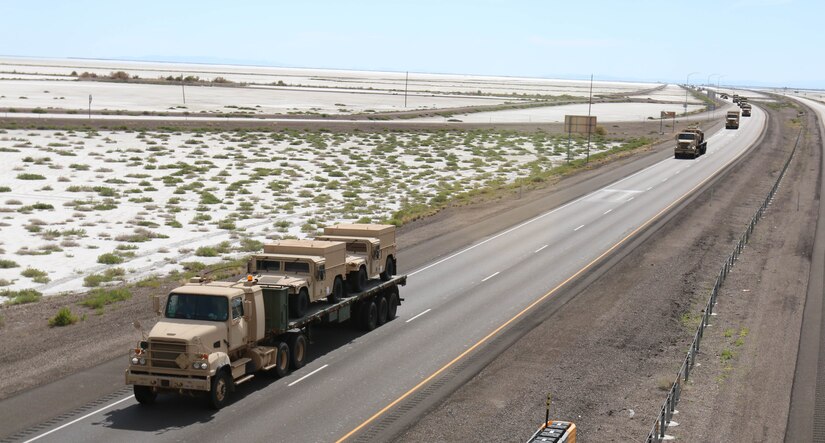 Elements of the 353rd Transportation Company, 103rd ESC passes by the Bonneville Salt Flats on its way into Nevada during the company's convoy operation from Buffalo, Minn.,  to Camp Roberts, Calif. The convoy operation began July 9 and moved 44 Soldiers and more than 20 cargo-laden military vehicles more than 2,000 miles cross-country as part of an annual training initiative known as Nationwide Move. The 353rd Transportation Company's westward trek not only provided training for its Soldiers, but also practical logistics support to its sister unit, the 322nd Maintenance Company, which will be conducting its annual training in California. (US Army  Photo by Sgt Victor Ayala, 210th MPAD)