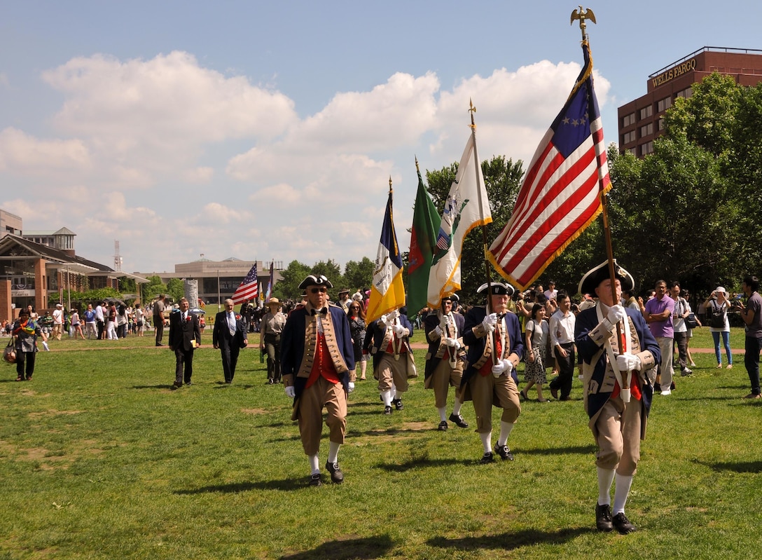 Service members, re-enactors and other citizens march from Philadelphia’s National Constitution Center to Independence Hall June 14 to celebrate Flag Day and the Army’s 240th birthday during the 2015 Stripes and Stars Festival. The festival was hosted by the William Penn Chapter of the Association of the U.S. Army and the Philadelphia Flag Day Association. (U.S. Army photo by Maj. Peter Lupo, 99th Regional Support Command)