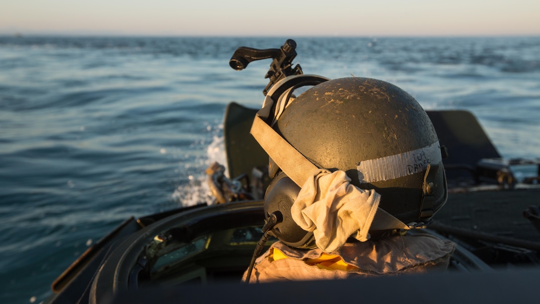 U.S. Marine Lance Cpl. David Belgard drives an AAV-P7/A1 Assault Amphibious Vehicle through the water during an amphibious assault at Fog Bay, Australia, July 11, 2015. The Marines with Company E, Battalion Landing Team 2nd Battalion, 5th Marines, 31st Marine Expeditionary Unit, and Australians with Combat Team Bravo, 2nd Battalion, Royal Australian Regiment, assaulted the beach and moved inland to secure additional objectives as part of Talisman Sabre 2015.  Talisman Sabre is a biennial exercise designed to improve the interoperability between Australian and U.S. forces. The 31st MEU is taking part in the exercise while deployed on its regularly scheduled Fall Patrol of the Asia-Pacific region. Belgard, a native of Huffman, Texas, is an AAV crew chief with Echo Co., BLT 2/5, 31st MEU.