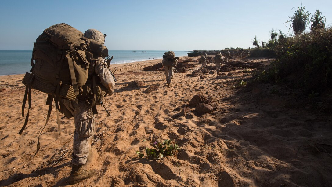 Marines begin to patrol inland to secure secondary objectives following an amphibious assault at Fog Bay, Australia, July 11, 2015. The Marines with Company E, Battalion Landing Team 2nd Battalion, 5th Marines, 31st Marine Expeditionary Unit, and Australians with Combat Team Bravo, 2nd Battalion, Royal Australian Regiment, assaulted the beach and moved inland to secure additional objectives as part of Talisman Sabre 2015. Talisman Sabre is a biennial exercise designed to improve the interoperability between Australian and U.S. forces. The 31st MEU is taking part in the exercise while deployed on its regularly scheduled Fall Patrol of the Asia-Pacific region. 