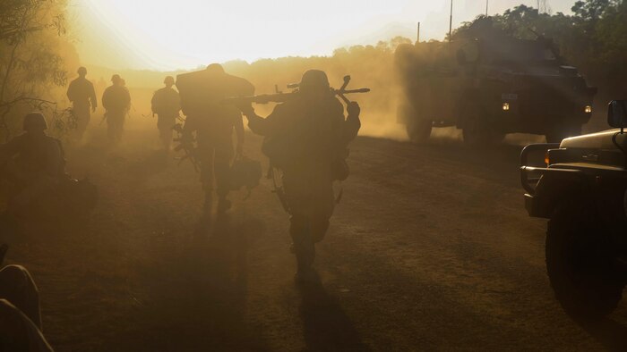 U.S. Marines and Australian service members move into defensive positions for the night after conducting an amphibious assault at Fog Bay, Australia, July 11, 2015. The Marines with Company E, Battalion Landing Team 2nd Battalion, 5th Marines, 31st Marine Expeditionary Unit, and Australians with Combat Team Bravo, 2nd Battalion, Royal Australian Regiment, assaulted the beach and moved inland to secure additional objectives as part of Talisman Sabre 2015.  Talisman Sabre is a biennial exercise designed to improve the interoperability between Australian and U.S. forces. The 31st MEU is taking part in the exercise while deployed on its regularly scheduled Fall Patrol of the Asia-Pacific region. 