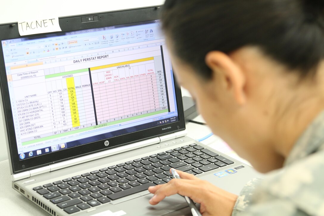 Spc. Donna C. Moya, a human resources specialist in the 303rd Maneuver Enhancement Brigade, works on the daily personnel status report during exercise Imua Dawn at Sagami Depot, Japan. The Imua Dawn exercise will be the culminating training event for the 303rd MEB to achieve full operational capability status in phase 3 operations.