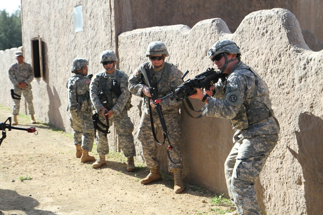 U.S. Army Reserve Theater Support Group - Pacific soldiers perform clearing procedures as part of the unit's first consolidated annual training exercise at Bellows Air Force Base, March 6. The unit, which encompasses Alaska, American Samoa, Guam, Hawaii and Siapan, was put to the ultimate test during its weeklong training event to work together as they tackled simulated combat situations.