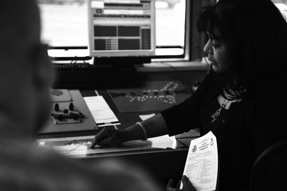 Zelda Montoya, a 422nd Air Base Group air traffic manager, explains operational procedures to Airmen during a training exercise at Royal Air Force Fairford, England, June 4, 2015. Montoya said she enjoyed imparting the experiences she garnered from 35 years as a trained air traffic controller. (U.S. Air Force photo/Tech. Sgt. Chrissy Best)