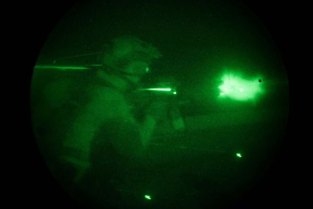 GULF OF ADEN (July 14, 2015) A U.S. Marine with the 15th Marine Expeditionary Unit’s Maritime Raid Force aims at his target during a night deck shoot aboard the amphibious assault ship USS Essex (LHD 2). Shooting accurately with low light is a critical skill for the MRF Marines so they are proficient in night-time conditions. The 15th MEU is embarked on the Essex Amphibious Ready Group and is deployed to maintain regional security in the U.S. 5th Fleet area of operations. (U.S. Marine Corps photo by Cpl. Anna Albrecht/Released)