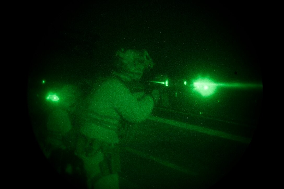 GULF OF ADEN (July 14, 2015) A U.S. Marine with the 15th Marine Expeditionary Unit’s Maritime Raid Force aims at his target during a night deck shoot aboard the amphibious assault ship USS Essex (LHD 2). Shooting accurately with low light is a critical skill for the MRF Marines so they are proficient in night-time conditions. The 15th MEU is embarked on the Essex Amphibious Ready Group and is deployed to maintain regional security in the U.S. 5th Fleet area of operations. (U.S. Marine Corps photo by Cpl. Anna Albrecht/Released)
