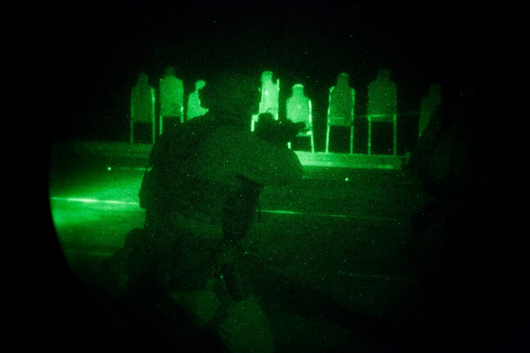GULF OF ADEN (July 14, 2015) A U.S. Marine with the 15th Marine Expeditionary Unit’s Maritime Raid Force aims at his target during a night deck shoot aboard the amphibious assault ship USS Essex (LHD 2). Shooting accurately with low light is a critical skill for the MRF Marines so they are proficient in night-time conditions. The 15th MEU is embarked on the Essex Amphibious Ready Group and is deployed to maintain regional security in the U.S. 5th Fleet area of operations. (U.S. Marine Corps photo by Cpl. Anna Albrecht/Released)