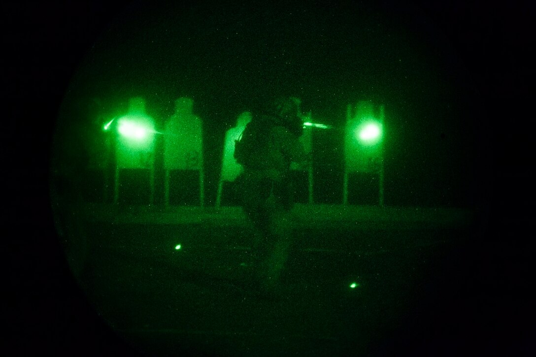 GULF OF ADEN (July 14, 2015)  A U.S. Marine with the 15th Marine Expeditionary Unit’s Maritime Raid Force aims at his target during a night deck shoot aboard the amphibious assault ship USS Essex (LHD 2). Shooting accurately with low light is a critical skill for the MRF Marines so they are proficient in night-time conditions. The 15th MEU is embarked on the Essex Amphibious Ready Group and is deployed to maintain regional security in the U.S. 5th Fleet area of operations. (U.S. Marine Corps photo by Cpl. Anna Albrecht/Released)