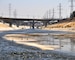 Water flows through the concrete channel of the Los Angeles River on its journey towards the Pacific Ocean Aug. 12, 2013.