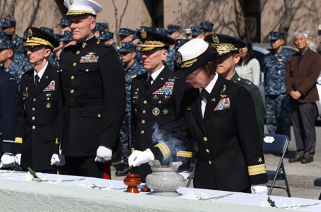 SEOUL, Republic of Korea (March 24, 2015) – Rear Adm. Lisa Franchetti, Commander, U.S. Naval Forces Korea, burns incense in front of a memorial dedicated to the Korean sailors lost during the sinking of ROKS Cheonan (PCC-772) during a memorial service at the CNFK headquarters in Seoul. The 1,200-ton ship broke into two from an explosion, suspected to be from a North Korean torpedo, on March 26, 2010, while operating in waters west of the Korean peninsula. Of the 104-man crew, 46 Korean Sailors perished in the incident, along with a ROK navy diver who lost his life during the subsequent rescue efforts. (U.S. Navy photo by Mass Communication Specialist 1st Class Abraham Essenmacher / Released) 