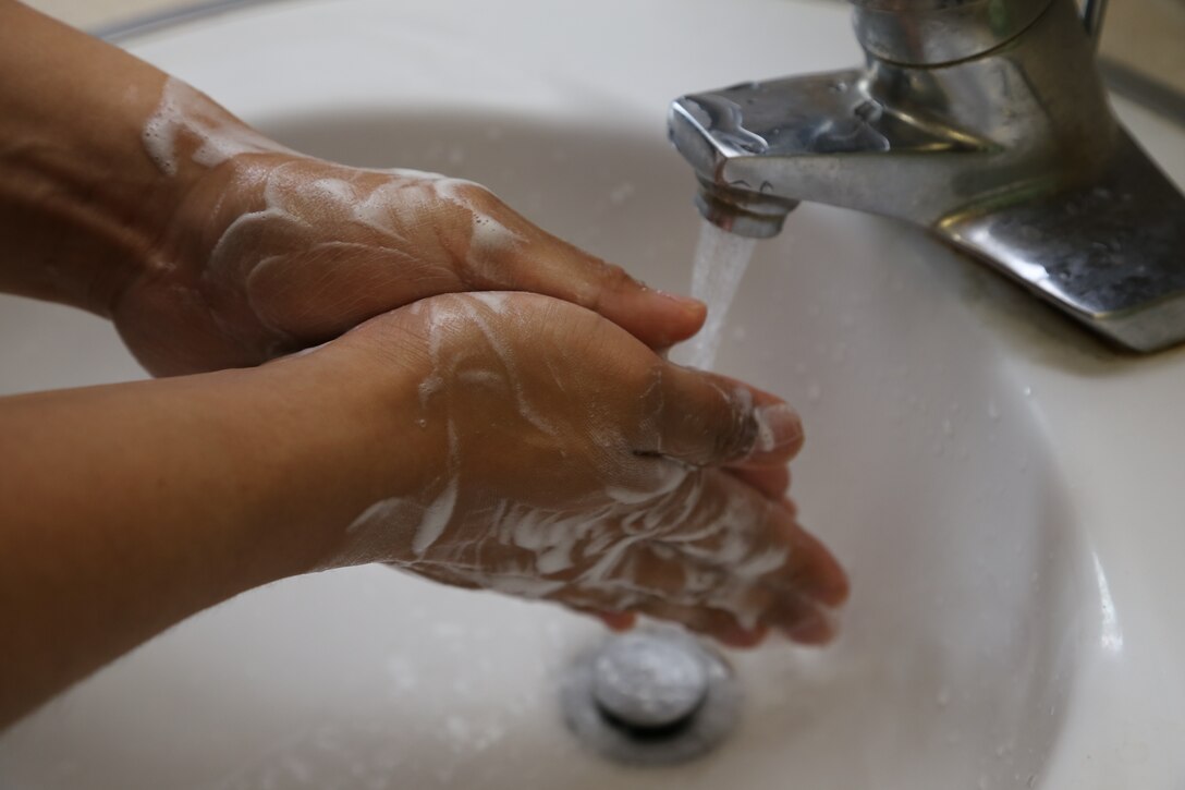 YONGSAN, Republic of Korea – On July 1, a United States Forces Korea service member washes their hands with soap and water as a precautionary measure to prevent the spread of Middle Eastern Respiratory Syndrome (MERS). (U.S. Army photo by Sgt. Russell Youmans). 