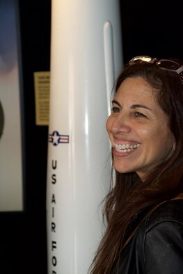 Andrea Garcia, 571st Mobility Support Advisory Squadron honorary commander and Touro University California director of external relations, stands near memorabilia at the 30th Space Wing Space and Missile Heritage Center during a fly-away civic leader tour to Vandenberg Air Force Base July 14, 2015. While at Vandenberg AFB, the civic leaders toured a number of rocket launch locations, visited the SpaceX Falcon 9 rocket assembly building and experienced the installation's launch control facilities. (U.S. Air Force photo/2nd Lt. Stephen J. Collier)