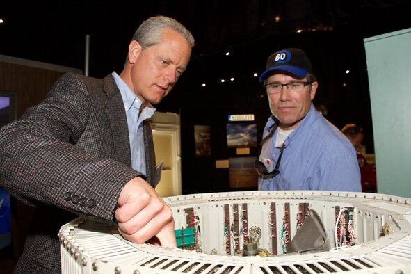 John Carli, 301st Airlift Squadron honorary commander and Vacaville Police Department police chief (left), and Monte Hoover, 15th Air Mobility Operations Squadron honorary commander and Gillespie's Abbey Carpet & Floor president and general manager, look at memorabilia at the 30th Space Wing Space and Missile Heritage Center during a fly-away civic leader tour to Vandenberg Air Force Base July 14, 2015. The purpose of fly-away civic leader tours is to give community leaders an opportunity to better understand the home unit and other Air Force installation’s missions and provide a greater insight into the Air Force's capabilities in air, space and cyberspace by exposing key community leaders to them. (U.S. Air Force photo/2nd Lt. Stephen J. Collier)