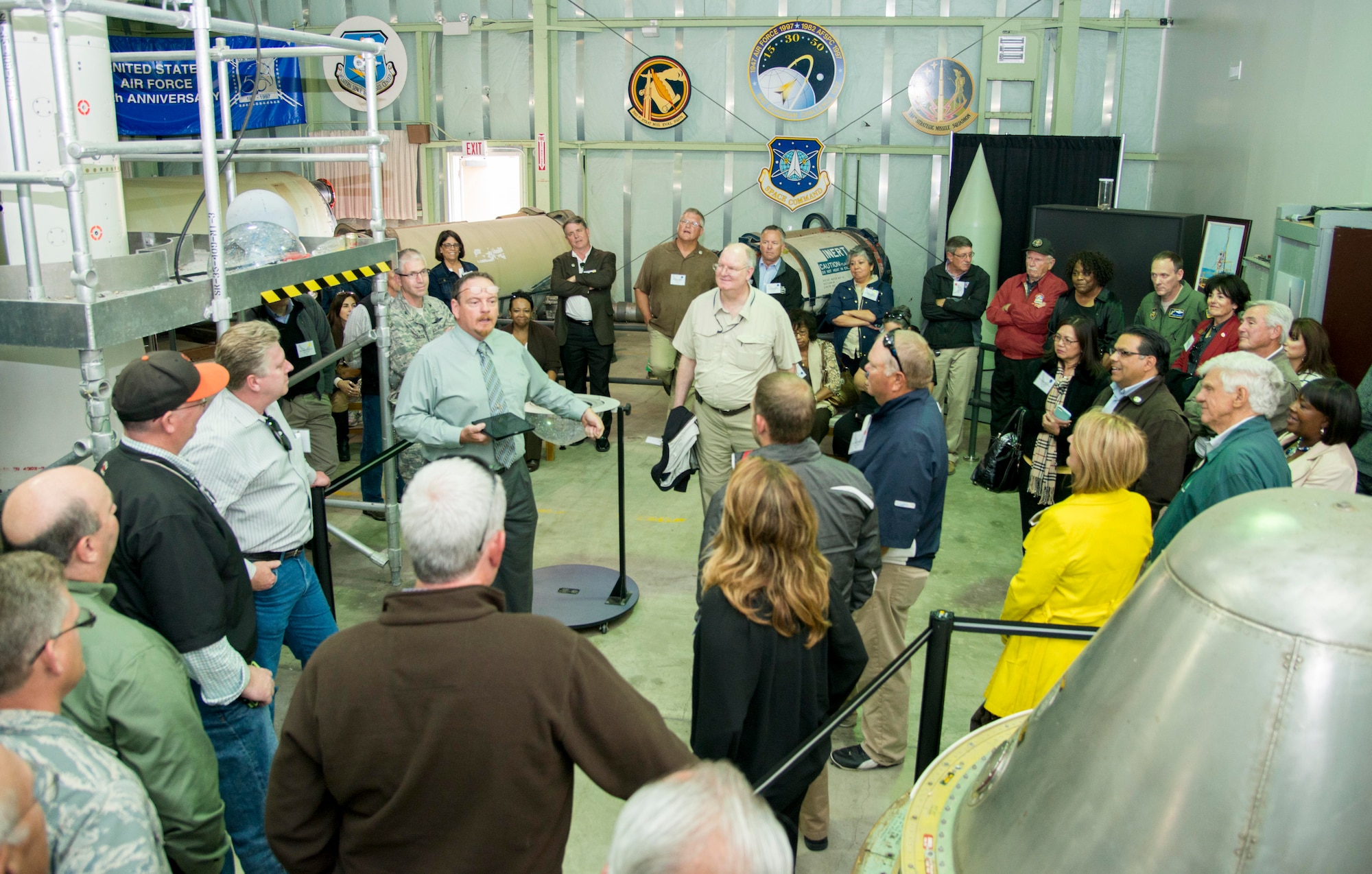 Donald Prichard, 30th Space Wing Space and Missile Heritage Center curator, briefs Travis’ civic leaders and honorary commanders about Vandenberg Air Force Base history during a fly-away civic leader tour July 14, 2015. The Space and Missile Heritage Center is located at Space Launch Complex 10, Vandenberg's only National Historic Landmark and displays artifacts and memorabilia to interpret the evolution of missile and spacelift activity at Vandenberg from the beginning of the Cold War through current non-classified developments in military, commercial, and scientific space endeavors. (U.S. Air Force photo/Senior Airman Nicole Leidholm)