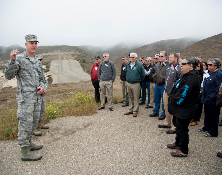 Capt. Adam Rich, 4th Space Launch Squadron Evolved Expendable Launch Vehicle project officer, briefs Travis’ civic leaders and honorary commanders at Space Launch Complex-6 during a fly-away civic leader tour to Vandenberg Air Force Base July 14, 2015. The 4th SLS’ Delta IV and Atlas V launch vehicles provide the nation's sole medium/heavy lift capability to polar orbit. Insight into EELV operations enables the squadron's essential mission of providing continuous risk assessment and mission assurance for the 30th Space Wing and the Space and Missile Systems Center. (U.S. Air Force photo/Senior Airman Nicole Leidholm)