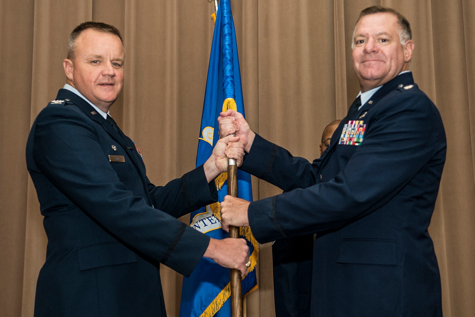 U.S. Air Force Lt. Col. Leo Kamphaus Jr. (right), assumes command of the 307th Maintenance Group during a ceremony on July 12, 2015, Barksdale Air Force Base, La. As commander, Kamphaus is responsible for providing daily program management, direction and guidance to 625 Air Reserve Technicians and traditional reservists and 250 active-duty Air Force personnel dedicated to the repair, inspection and maintenance of eighteen B-52H aircraft. (U.S. Air Force photo by Master Sgt. Greg Steele/Released)