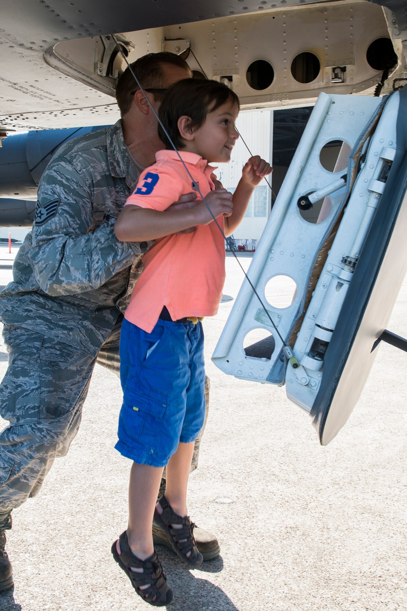 Leo Kamphaus III is helped up into the cockpit of a 307th Bomb Wing B-52H Stratofortress on July 12, 2015, Barksdale Air Force Base, La. Leo is the son of U.S. Air Force Lt. Col. Leo Kamphaus Jr., who assumed command of the 307th Maintenance Group. (U.S. Air Force photo by Master Sgt. Greg Steele/Released)