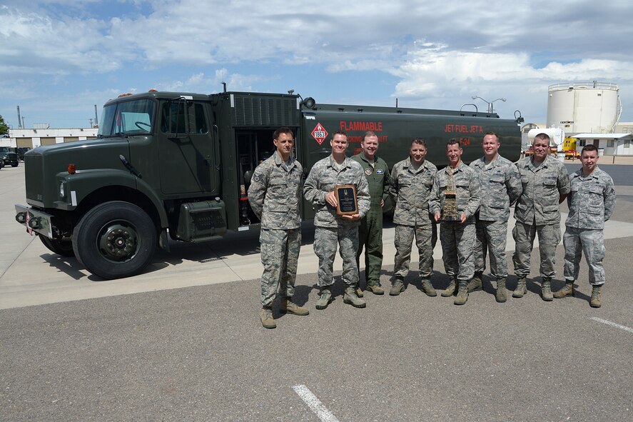Maj. Gen. Richard Scobee, 10 Air Force commander, poses with members of the 419th Logistics Readiness Squadron fuels shop after he awarded them the “Golden Derrick Award” here July 15. (U.S. Air Force photo/Alex Lloyd)