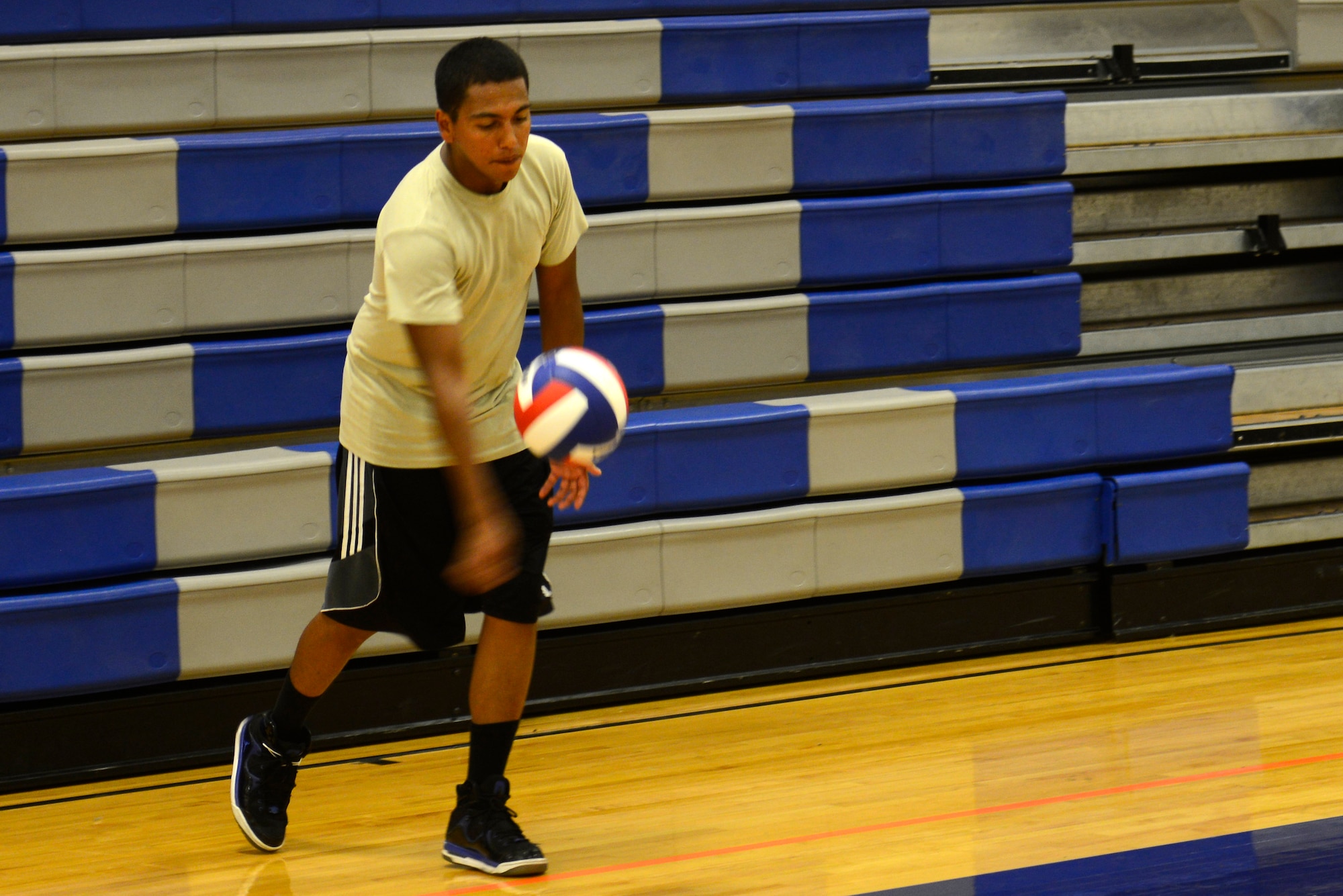 Airmen, dependents and their friends play volleyball at the McConnell Fitness Center, July 14, 2015, at McConnell Air Force Base, Kan. More than 30 people of various skillsets gathered in their off time to play against one another. Volleyball is one of many options McConnell members have at the base gym to work on their resiliency and fitness. (U.S. Air Force photo by Senior Airman Trevor Rhynes)