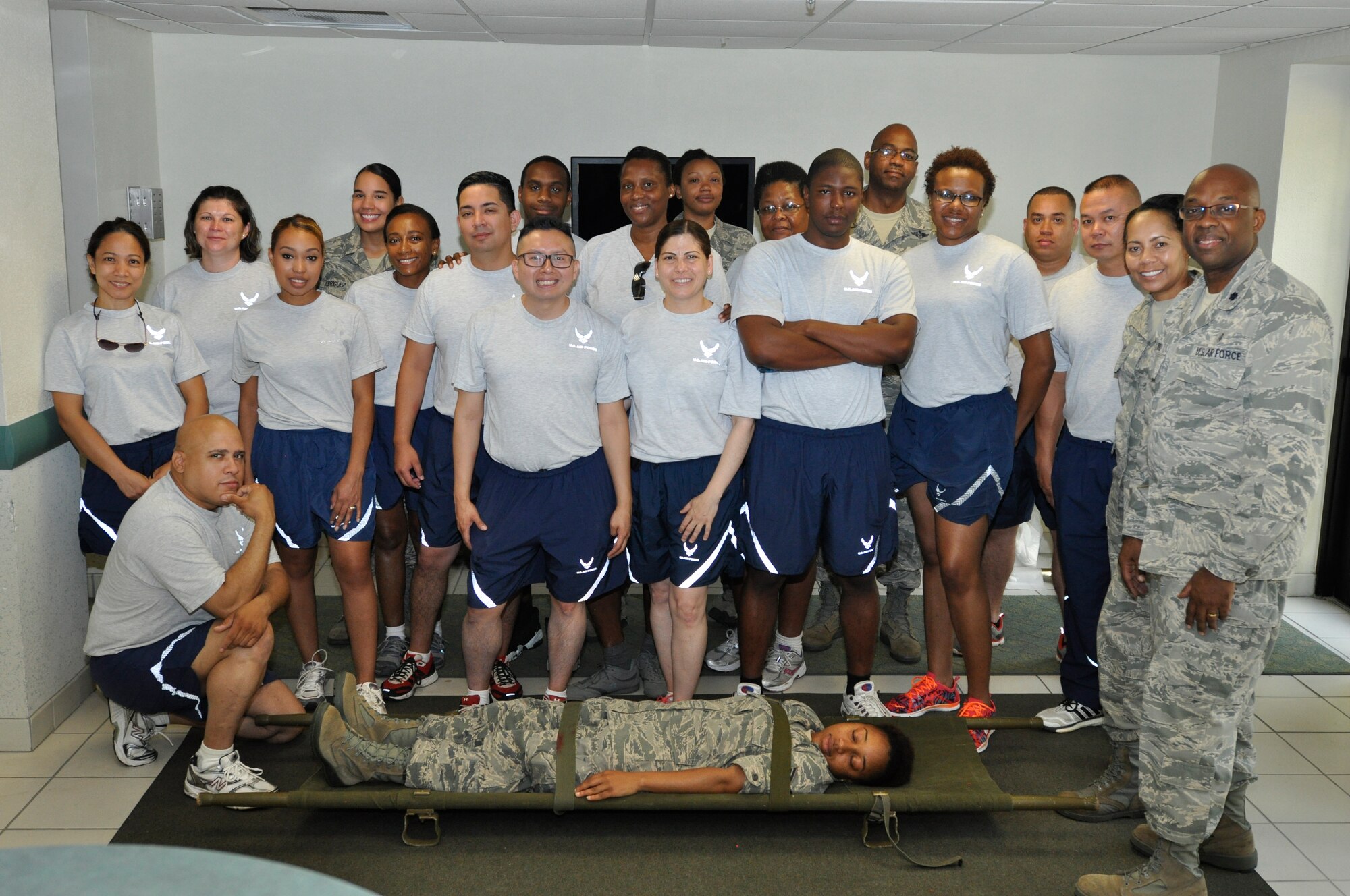 Members of the 514th Aerospace Medicine Squadron and 514th Aeromedical Staging Squadron, take a break July 11, 2015, at Naval Air Station Key West, Fla. 514th Airmen practiced proper litter carry, lift, rotation and evacuation of injured patients. (U.S. Air Force photo/Senior Airman Jasmine Zielomski)