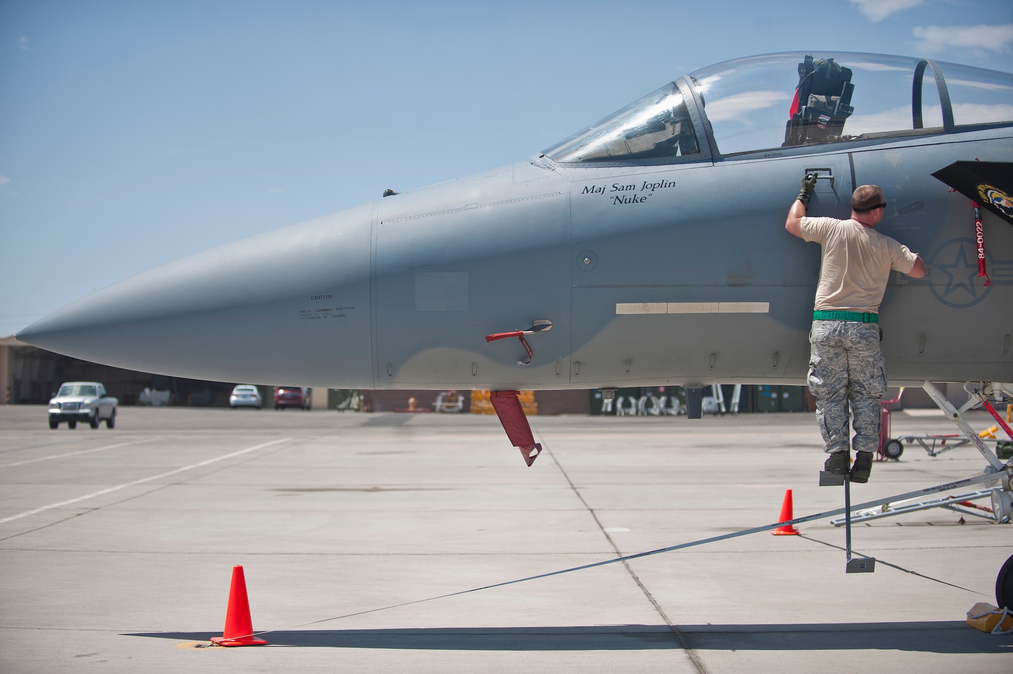 A maintainer assigned to the 159th Maintenance Squadron, Louisiana Air National Guard, inspects a component on an F-15 Eagle during Red Flag 15-3 at Nellis Air Force Base, Nev., July 14, 2015. Red Flag provides a series of intense air-to-air scenarios for aircrew and ground personnel to increase their combat readiness and effectiveness for future real-world operations. (U.S. Air Force photo by Staff Sgt. Siuta B. Ika)