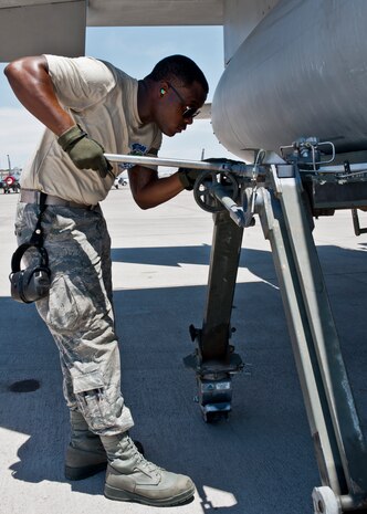 Senior Airman Quenton Richardson, 159th Maintenance Squadron crew chief, Louisiana Air National Guard, removes an external fuel tank on an F-15 Eagle during Red Flag 15-3 at Nellis Air Force Base, Nev., July 14, 2015. Crew chiefs are responsible for overseeing the day-to-day maintenance of aircraft including diagnosing malfunctions and replacing components to ensure the aircraft functions properly. (U.S. Air Force photo by Airman 1st Class Jake Carter)