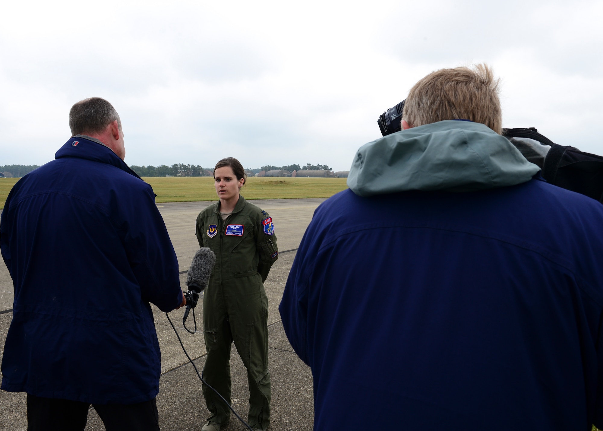 Capt. Jessica Wyble, 354th Expeditionary Fighter Squadron pilot, is interviewed by Independent Television reporters at Royal Air Force Lakenheath, England, July 15, 2015. Media members drove in from all over England; some commuting up to 220 miles just to witness the sight A-10’s on RAF Lakenheath. (U.S. Air Force photo by Senior Airman Nigel Sandridge/Released)