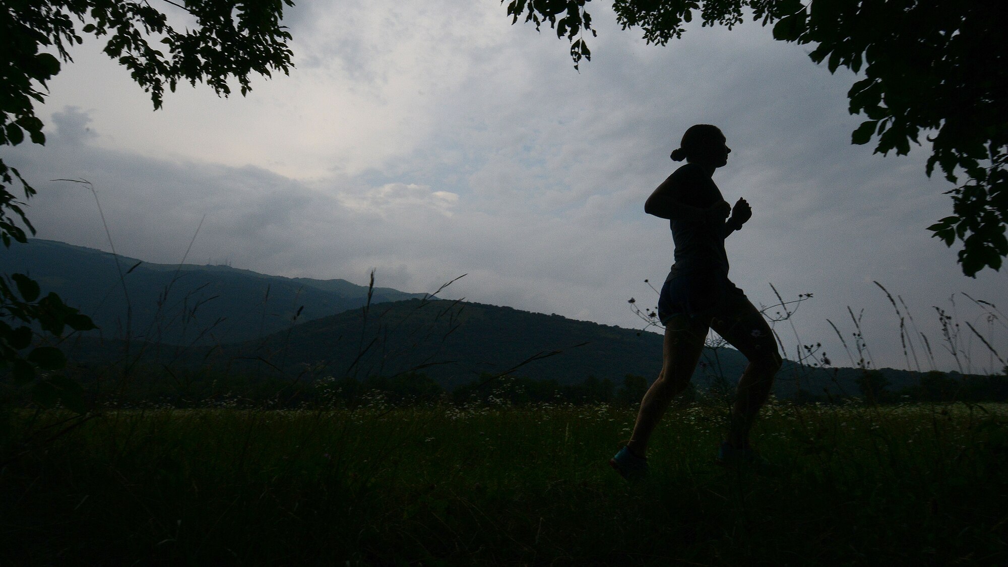 U.S. Air Force Senior Airman Tasha Cobb, 31st Force Support Squadron outbound assignments counselor, runs on a trail, July 8, 2015, in Aviano, Italy.  Cobb participates in local runs with the Aviano Roadrunners team.  Runs are held on the weekends and are open to all Team Aviano members. (U.S. Air Force photo by Staff Sgt. Evelyn Chavez/Released)