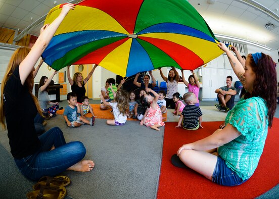 Children and parents play during JAM Summer Camp, July 14, 2015 at Aviano Air Base, Italy. In addition to playing tunes, the children also shared, interacted and played with other kids. (U.S. Air Force photo by Senior Airman Austin Harvill/Released)