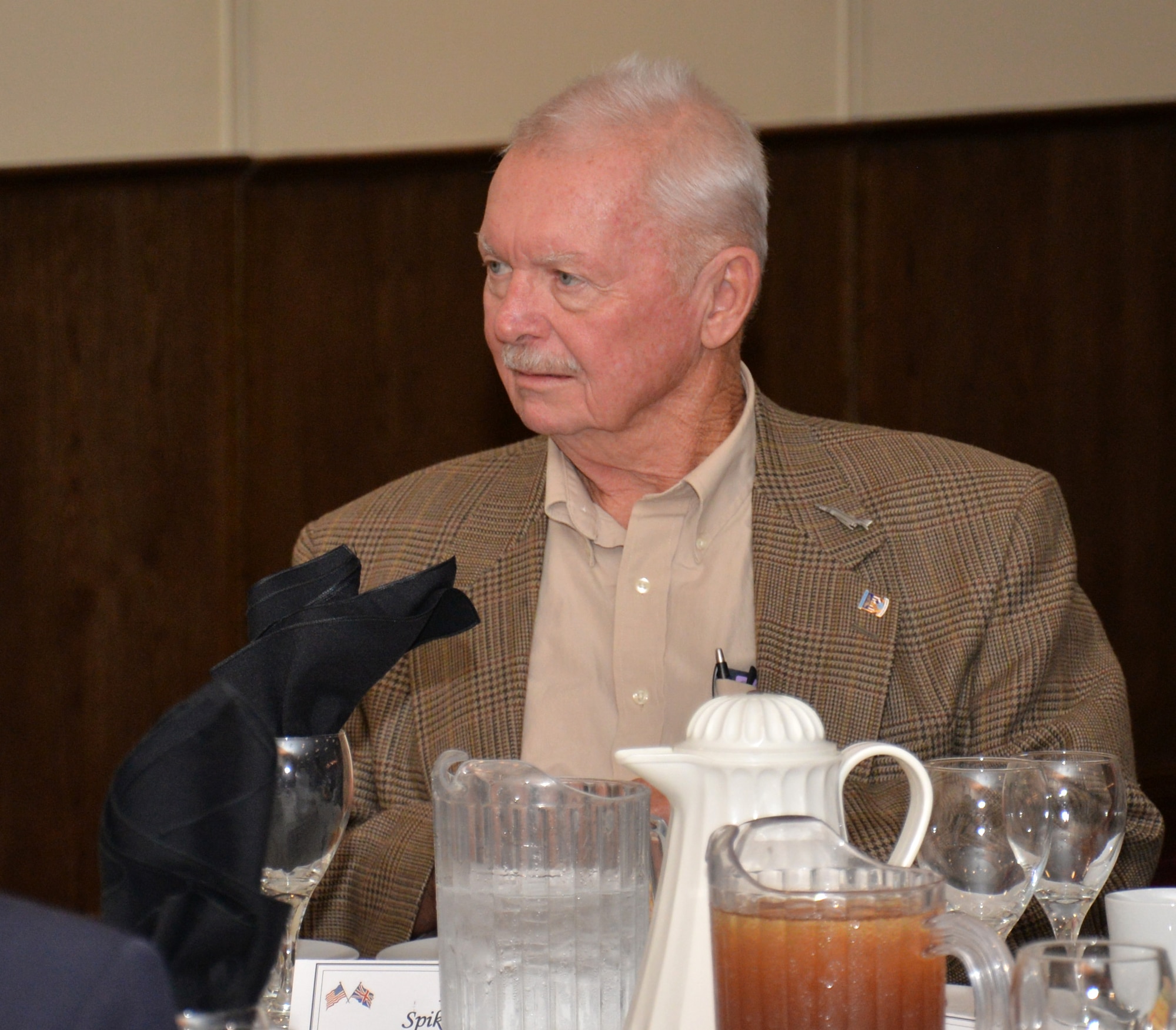U.S. Air Force retired Maj. Spike Nasmyth speaks with Team Mildenhall members during a lunch in his honor July 8, 2015, in the Galaxy Club on RAF Mildenhall, England. Nasmyth was a prisoner of war for more than six years until he was freed Feb. 17, 1973. (U.S. Air Force photo by Gina Randall/Released)