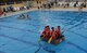 Participants of the 2nd Annual Cardboard Cup Race paddle across the base pool July 10, 2015, at Incirlik Air Base, Turkey. Teams constructed boats made of cardboard and duct tape to race each other to the end of the pool and back. (U.S. Air Force photo by Senior Airman Michael Battles/Released)