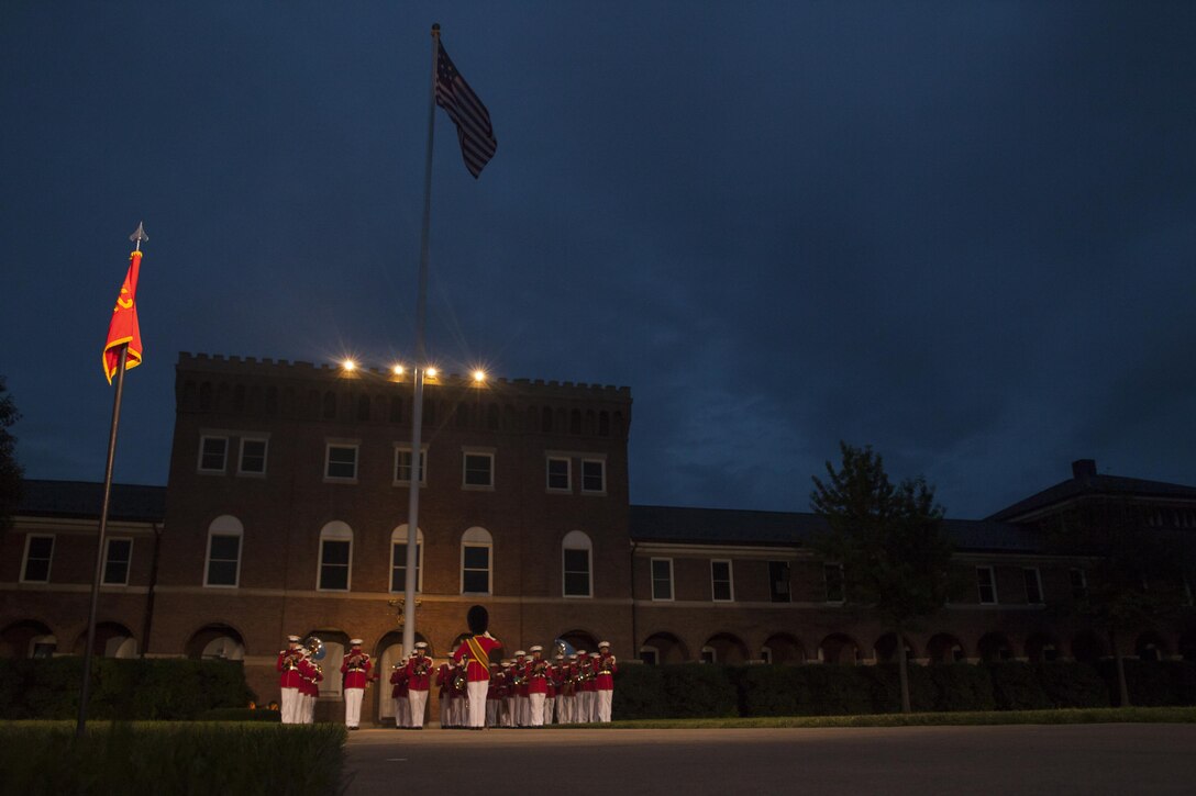 Members of the U.S. Marine Band perform during an evening parade at Marine Barracks Washington, D.C., July 10, 2015. U.S. Marine Corps Gen. Joseph Dunford Jr., commandant of the Marine Corps, was the hosting official for the July 10 evening parade, and the Guest of Honor were eight congressional Marines, to include Sen. Charles Roberts, Sen. Daniel Sullivan, Rep. John Kline, Rep. Michael Coffman, Rep. Scott Rigell, Rep. Paul Cook, Rep. Mike Bost and Rep. Ruben Gallego (U.S. Marine Corps Photo by Lance Cpl. Alejandro Sierras/ Released)
