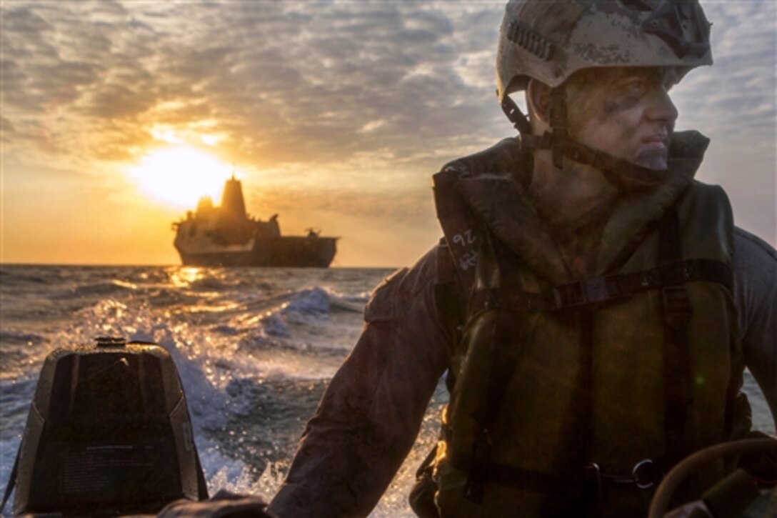 U.S. Marine Corps Lance Cpl. Chance Seckenger participates in launch-and-recovery drills in a combat rubber raiding craft during Exercise Talisman Sabre 2015 after launching from the well deck of the USS Green Bay at sea, July 9, 2015. Seckenger is assigned to Fox Company, Battalion Landing Team 2nd Battalion, 5th Marine Regiment, 31st Marine Expeditionary Unit.