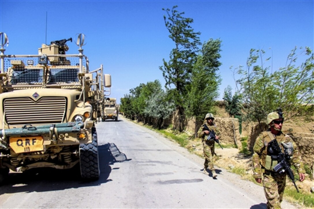 U.S. Marines and Georgian soldiers patrol a village in Parwan province near Bagram Airfield, Afghanistan, July 10, 2015. The Marines are assigned to U.S. Forces Afghanistan, Task Force Solid.