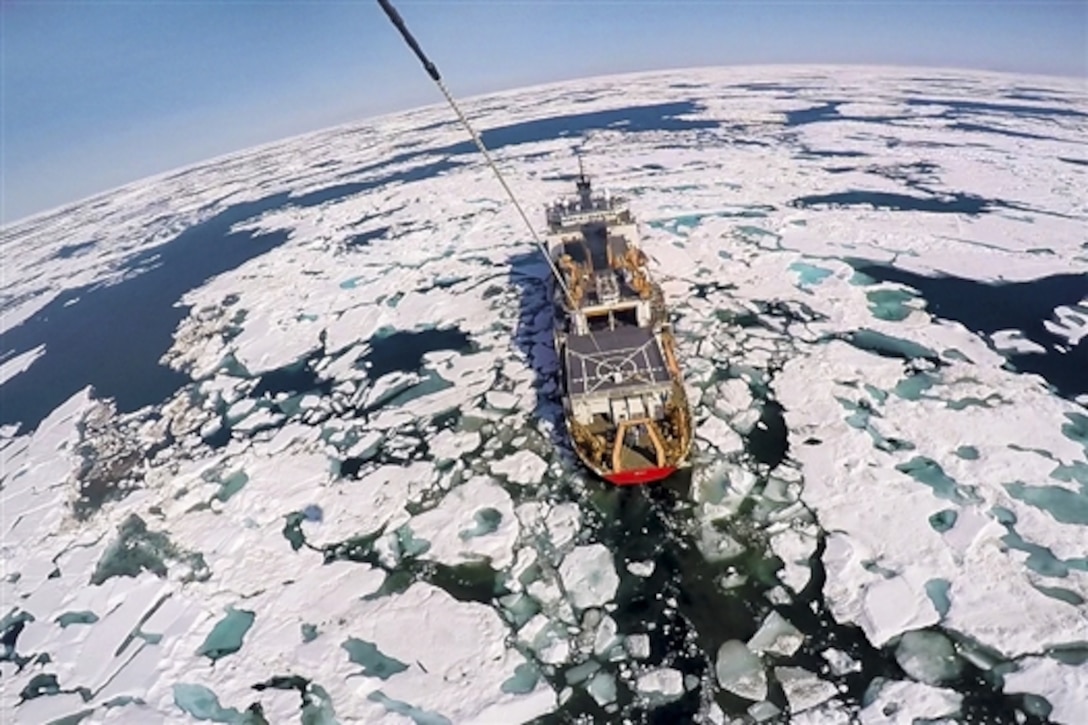 The Coast Guard Cutter Healy breaks through ice in the Arctic Circle, July 14, 2015. An aerostat aircraft, a self-contained, compact platform, produced this image.