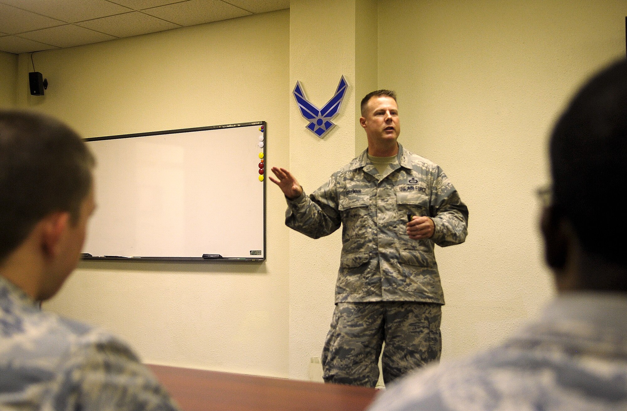 U.S. Air Force Chief Master Sgt. Charles R. Hoffman, 18th Wing command chief, speaks with Airmen of all ranks, civilians and local nationals to discuss hot topic questions at the McDaniel Center on Kadena Air Base, Japan, July 16, 2015. This month, Hoffman focused on positive leadership, but he will have a different topic of discussion each month to cover as many topics as possible. (U.S. Air Force photo by Airman 1st Class Zackary A. Henry)