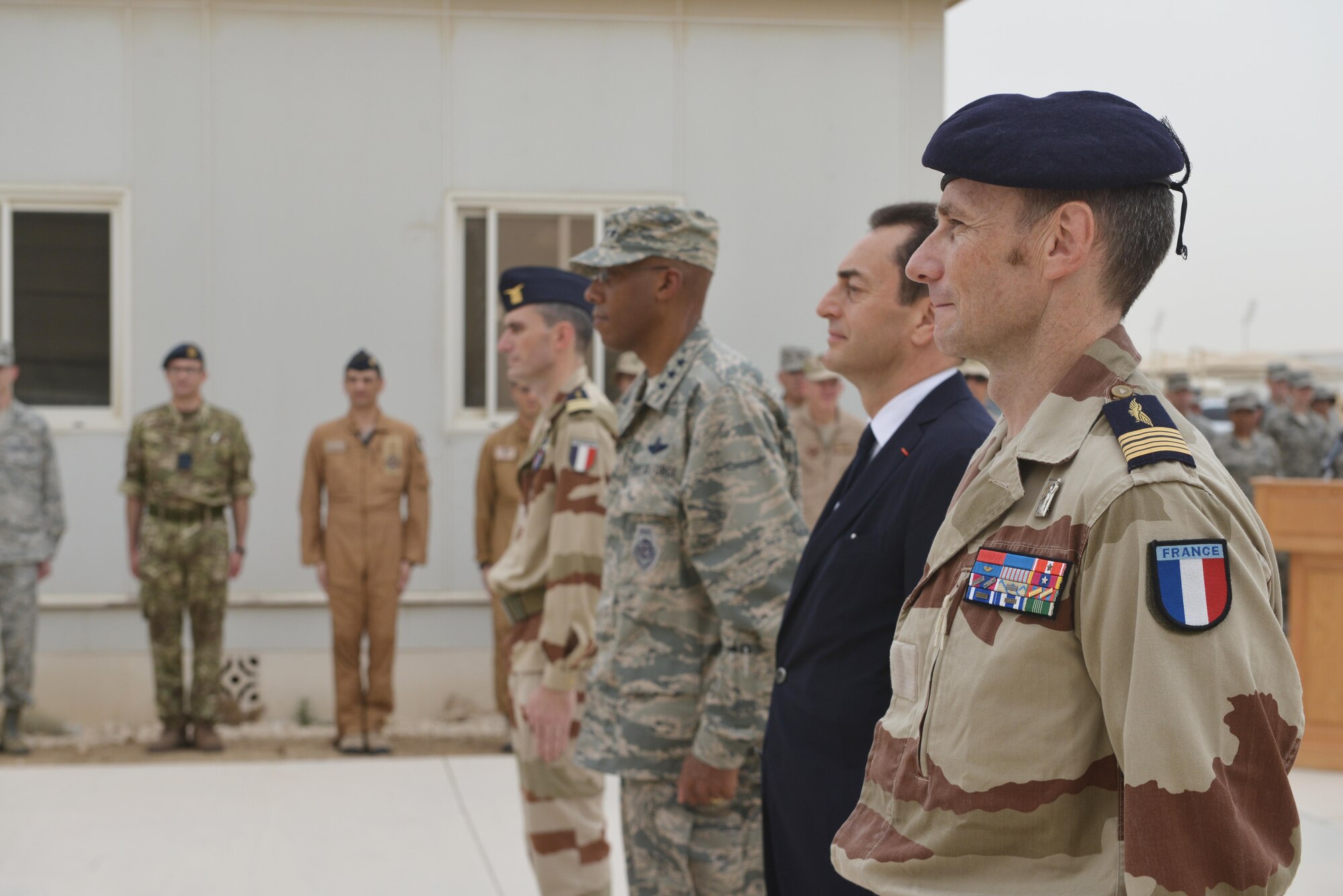 Coalition Forces commanders stand at attention after recognizing French National Defense Medal recipients during the Bastille Day ceremony July 14, 2015 at Al Udeid Air Base, Qatar. The French celebrate July 14th as Bastille Day to commemorate the storming of Bastille at the beginning of the French revolution in 1789. (U.S. Air Force photo/Staff Sgt. Alexandre Montes) 
