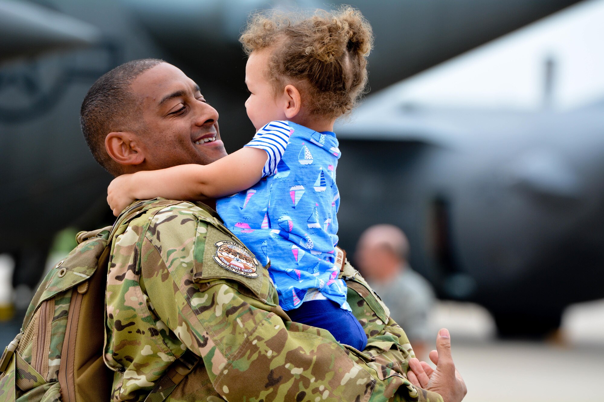 U.S. Airmen assigned to the 139th Airlift Wing, Missouri Air National Guard, return home from a deployment to Southwest Asia at Rosecrans Air National Guard Base, St. Joseph, Mo., July 8, 2015. The Airmen were deployed for 120 days supporting airlift missions to the region. (U.S. Air National Guard photo by Senior Airman Bruce Jenkins)