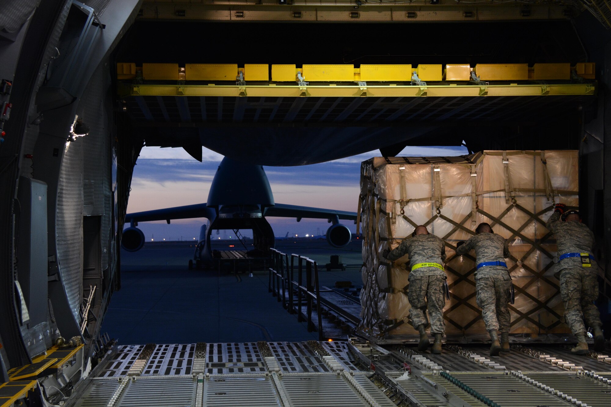 APEX students offload a pallet of household goods July 7, 2015 onto a 60K tunner at Travis Air Force Base, California. Students were required to complete a minimum of 36 hours of hands-on training as part of the APEX training course. (U.S. Air Force photo by Airman 1st Class Amber Carter)