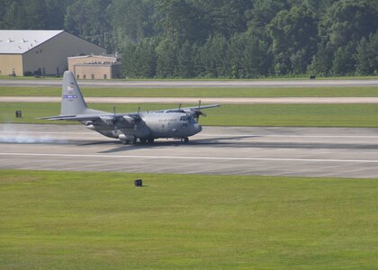 A C-130 Hercules takes off from the runway at Dobbins Air Reserve Base, Ga., July 11, 2015. Col. Brett Clark, 94th Airlift Wing commander, retired the same afternoon and flew for the last time with his son on board. (US Air Force Photo/ Senior Airman Miles Wilson)