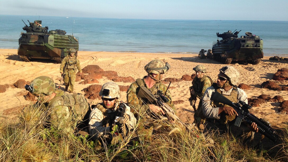 Australian Army soldiers, assigned to 2nd Battalion, Royal Australian Regiment, and U.S. Marines, assigned to Battalion Landing Team, 2nd Battalion, 5th Marines, work together during an amphibious assault exercise during Talisman Sabre 2015 at Fog Bay, Australia, July 11, 2015.  Talisman Sabre is a biennial exercise that provides an invaluable opportunity for nearly 30,000 U.S. and Australian Defence Force personnel to conduct operations in a combined, joint and interagency environment that will increase both countries’ ability to plan and execute a full range of operations from combat missions to humanitarian assistance efforts. 