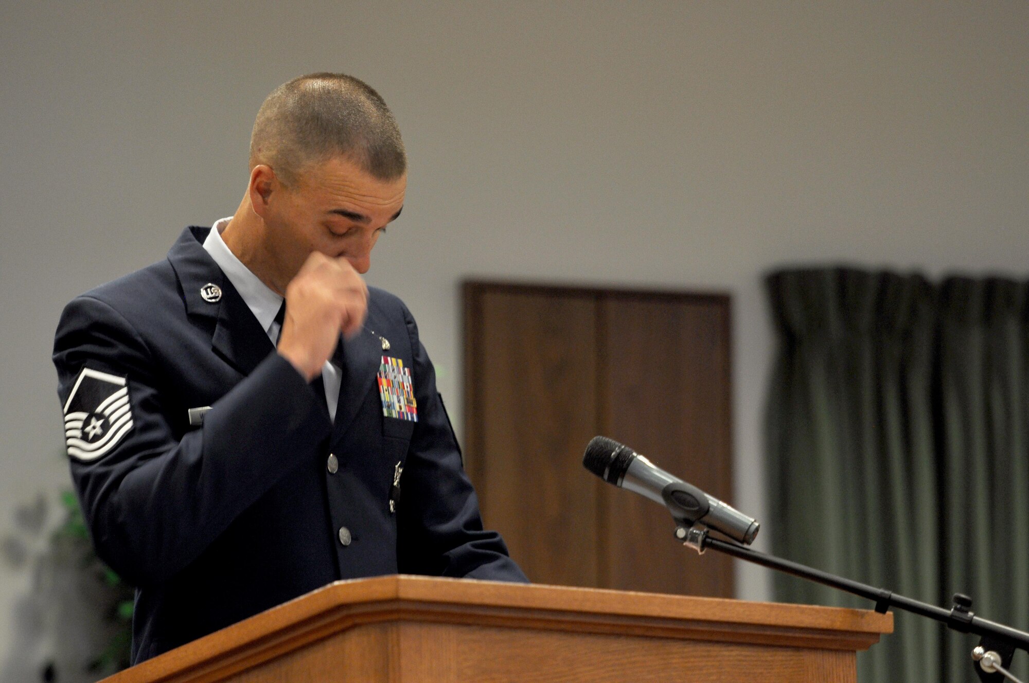 U.S. Air Force Master Sgt. Russell Weatherby, 17th Security Forces Squadron individual mobilization augmentee, reflects upon memories of Tech. Sgt. Christopher Kelley during the Memorial Service in his honor at the Taylor Chapel on Goodfellow Air Force Base, Texas, July 16, 2015. Kelley, 17th SFS IMA, was killed in the line of duty, June 24, in Hutto, Texas, while working for the Hutto Police Department.  (U.S. Air Force photo by Senior Airman Joshua Edwards/Released)