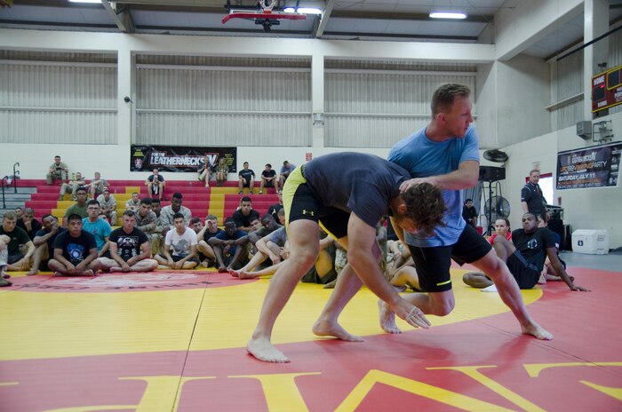 Mixed martial arts fighters Gray Maynard and Tom Lawlor demonstrate the counter to a take-down during the “For the Leathernecks IV” mixed martial arts clinic at the Semper Fit Center, July 10, 2015. Headquarters Marine Corps Single Marine Program and the Single Marine & Sailor Program at Marine Corps Base Hawaii hosted a clinic featuring professional fighters Lawlor, Maynard and Mark Munoz. The fighters taught Marines and Sailors various defensive grappling techniques. (U.S. Marine Corps photo by Kristen Wong/Released)
